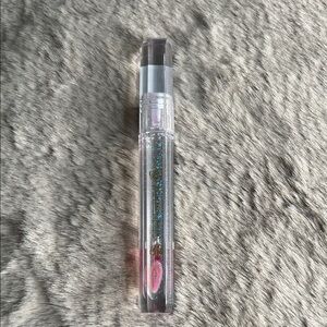 Revolution Glitter Lip Gloss with Pink and Blue Sparkle